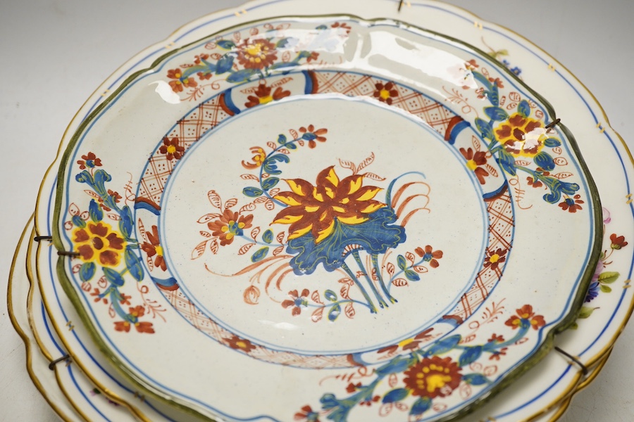 Three porcelain plates comprising an 18th century Meissen floral example and two Sevres, together with an 18th century polychrome tin glazed, largest 25cm in diameter. Condition - fair